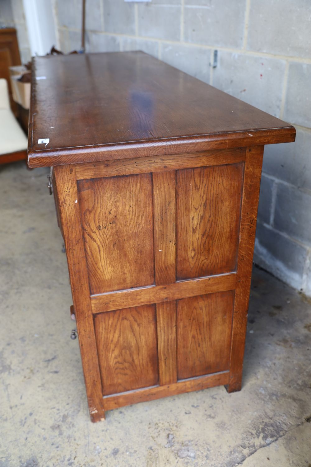 An 18th century style oak low dresser, width 168cm, depth 58cm, height 86cm